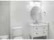 This well-lit bathroom features a tub and a vanity with storage at 8604 N Roxboro St, Bahama, NC 27503