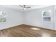 Cozy bedroom featuring wood-look flooring and natural light at 8604 N Roxboro St, Bahama, NC 27503
