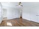 Bright bedroom features wood flooring, a ceiling fan, and dual closets, offering ample storage at 8604 N Roxboro St, Bahama, NC 27503
