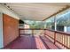 Covered wooden deck offering a relaxing outdoor space with views of the yard at 8604 N Roxboro St, Bahama, NC 27503