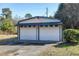 Spacious two-door garage with a white exterior and black trim, providing ample storage at 8604 N Roxboro St, Bahama, NC 27503