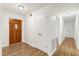 Inviting hallway featuring wood-look flooring and neutral walls at 8604 N Roxboro St, Bahama, NC 27503