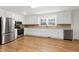 Well-lit kitchen with stainless steel appliances and ample counter space at 8604 N Roxboro St, Bahama, NC 27503