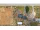 Aerial view of property showing layout, surrounding landscape, and proximity to the road at 879 Cheves Rd, Zebulon, NC 27597