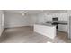 Spacious living area with a modern open-concept layout to the kitchen and lots of natural light at 909 Rhino Bnd, Oxford, NC 27565