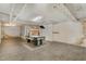 Finished basement featuring wood-look floors, an air hockey table, painted walls and exposed piping at 938 Hargrove St, Henderson, NC 27536