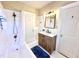 Bright bathroom featuring a shower/tub combo, modern lighting fixtures, and built in shelving at 938 Hargrove St, Henderson, NC 27536