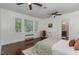 Bright bedroom featuring two ceiling fans and many windows allowing for ample natural light at 938 Hargrove St, Henderson, NC 27536