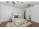 Cozy bedroom showcasing hardwood floors, decorative headboard and a neutral color palette at 938 Hargrove St, Henderson, NC 27536