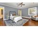 Bedroom features a large oriental rug, hardwood flooring and a comfortable seating area at 938 Hargrove St, Henderson, NC 27536