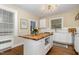 Charming kitchen featuring a butcher block island, hardwood floors and stainless appliances at 938 Hargrove St, Henderson, NC 27536