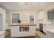 Charming kitchen with a butcher block island, white cabinets and hardwood floors at 938 Hargrove St, Henderson, NC 27536