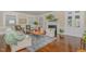 Bright living room with hardwood floors, a decorative fireplace, and comfortable seating at 938 Hargrove St, Henderson, NC 27536