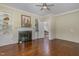 Living room featuring hardwood floors, built in bookcases, a fireplace and a light-colored walls at 938 Hargrove St, Henderson, NC 27536