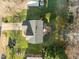 Birds eye view of the home showing the roof, backyard deck, and the surrounding landscaping at 1006 Scotsburg Trl, Hillsborough, NC 27278