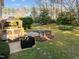 Backyard featuring a gazebo, grill, patio, stepping stones, and landscaping at 1006 Scotsburg Trl, Hillsborough, NC 27278
