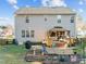The home's backyard includes a well-manicured lawn, deck with gazebo, and patio area at 1006 Scotsburg Trl, Hillsborough, NC 27278