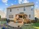 The home's backyard features a well-kept lawn, a patio area, and a deck with a covered gazebo at 1006 Scotsburg Trl, Hillsborough, NC 27278