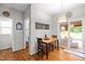 Cozy dining area features a wooden table set and sliding glass doors to an outdoor deck at 1006 Scotsburg Trl, Hillsborough, NC 27278