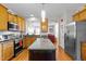 Eat-in kitchen features stainless steel appliances, granite countertops and a large center island at 1006 Scotsburg Trl, Hillsborough, NC 27278
