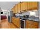 Well-equipped kitchen has granite countertops, modern appliances, and ample cabinet space at 1006 Scotsburg Trl, Hillsborough, NC 27278