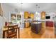The eat-in kitchen features granite counters, stainless appliances and an access to the backyard at 1006 Scotsburg Trl, Hillsborough, NC 27278