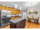 Kitchen with island, stainless steel appliances, granite counter tops and a breakfast nook at 1006 Scotsburg Trl, Hillsborough, NC 27278