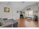 Spacious living room with a ceiling fan, hardwood floors, and natural light at 1006 Scotsburg Trl, Hillsborough, NC 27278