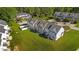 Aerial view of the townhomes showing the lawns and fencing of the homes at 101 Wimbledon Ct, Clayton, NC 27520