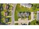 Aerial view showcasing townhomes with parking and green space in a well-maintained community at 101 Wimbledon Ct, Clayton, NC 27520