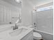 Bright bathroom featuring a white vanity with sink, toilet, and shower-tub combination at 101 Wimbledon Ct, Clayton, NC 27520