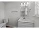 Bathroom features an undermount sink, toilet and white walls at 101 Wimbledon Ct, Clayton, NC 27520