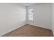 Cozy bedroom with neutral carpet and paint, illuminated by a window at 101 Wimbledon Ct, Clayton, NC 27520
