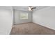 This bedroom features a ceiling fan and large window with natural light at 101 Wimbledon Ct, Clayton, NC 27520
