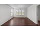 Dining room with hardwood floors, a chandelier, and natural light from the window at 101 Wimbledon Ct, Clayton, NC 27520