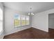 Dining room with hardwood floors, a chandelier, and large windows at 101 Wimbledon Ct, Clayton, NC 27520