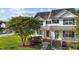 Charming two-story home with green shutters, lush lawn and mature landscaping on a sunny day at 101 Wimbledon Ct, Clayton, NC 27520