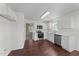An inviting kitchen with stainless steel appliances, white cabinets, and luxury vinyl plank flooring at 101 Wimbledon Ct, Clayton, NC 27520