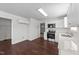 Bright kitchen featuring stainless steel appliances, solid surface counters, and luxury vinyl plank flooring at 101 Wimbledon Ct, Clayton, NC 27520