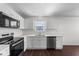Bright and modern kitchen featuring stainless steel appliances, stylish white cabinets, and sleek countertops at 101 Wimbledon Ct, Clayton, NC 27520