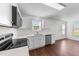 Modern kitchen featuring stainless steel appliances, white cabinetry, and bright countertops with a view at 101 Wimbledon Ct, Clayton, NC 27520