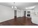 Open living room with luxury vinyl plank flooring connecting to the kitchen and pantry at 101 Wimbledon Ct, Clayton, NC 27520