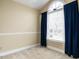 Cozy bedroom with a large window, neutral paint, and natural light at 103 Glenstone Ln, Cary, NC 27518