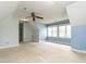 Bright attic bedroom with neutral carpet and blue paint at 103 Glenstone Ln, Cary, NC 27518