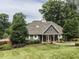 Exterior view of the community clubhouse with well-maintained landscaping at 103 Glenstone Ln, Cary, NC 27518