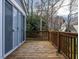 Exterior deck constructed of natural wood with railings and access to the backyard at 103 Glenstone Ln, Cary, NC 27518