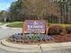 A beautifully landscaped Lochmere Swim & Tennis Club sign surrounded by flowers at 103 Glenstone Ln, Cary, NC 27518