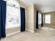 Bright living room with large windows and an abundance of natural light at 103 Glenstone Ln, Cary, NC 27518