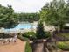 Community pool with lounge chairs and lush landscaping at 103 Glenstone Ln, Cary, NC 27518