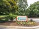 Sign for the Recreation Club of Lochmere surrounded by landscaping at 103 Glenstone Ln, Cary, NC 27518